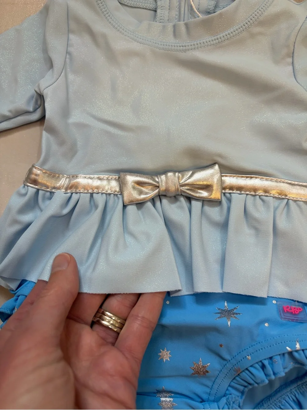 NWT RuffleButts Blue Glass Slipper Princess Long Sleeve Rash Guard Swimsuit 0-3M